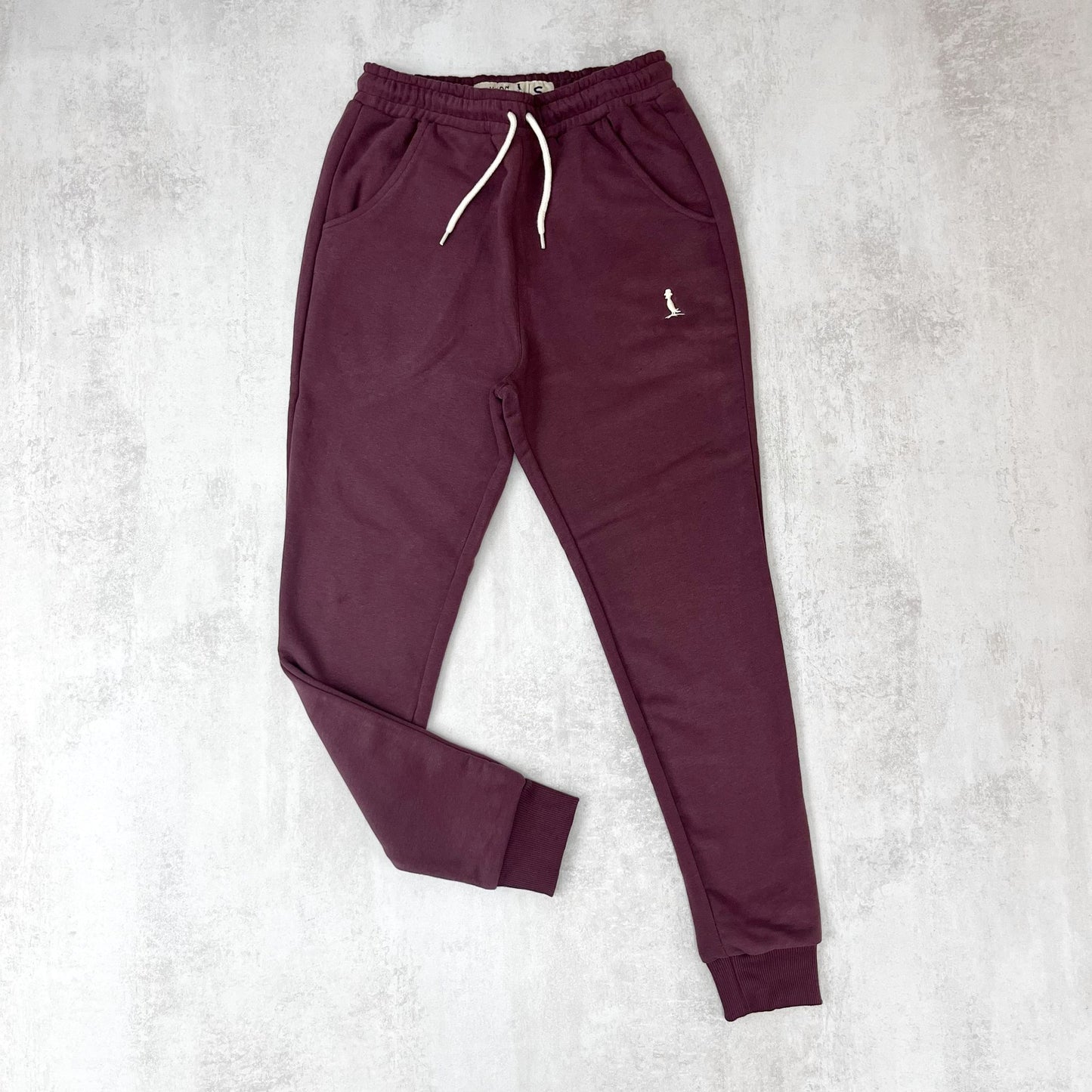 JOGGER CON PUÑO COLOR BORDÓ