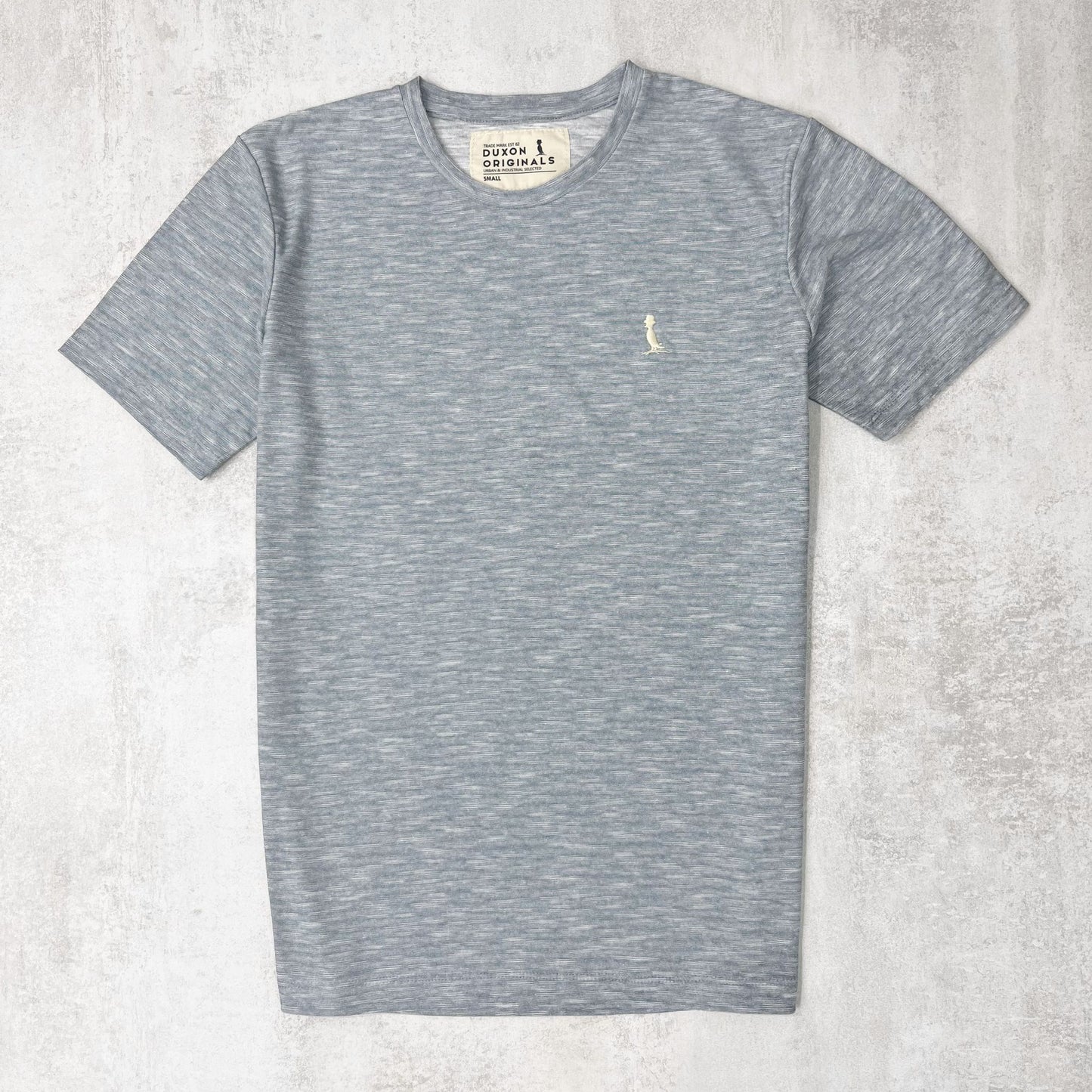REMERA BASICA CELESTE JASPEADA